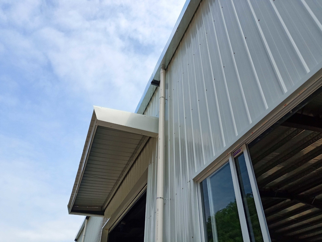 Fireproof Material Metal Steel Plate Steel Structure Building Warehouse With Electric Rolling Shutter Door